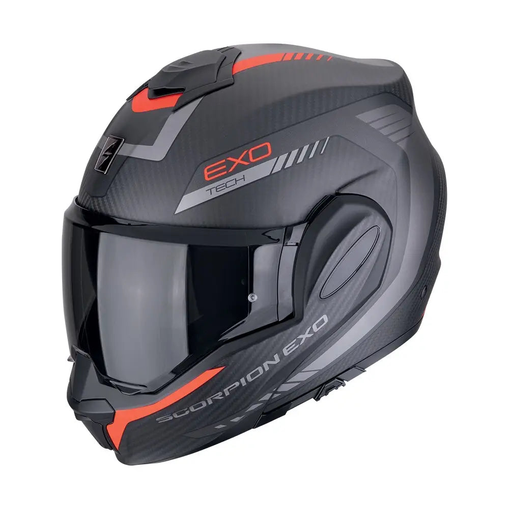 Een modulaire motorhelm met een carbon buitenlaag in mat zwart en rood, de Scorpion Exo-Tech Evo Carbon Cosy, die stijl en bescherming biedt voor lange ritten.